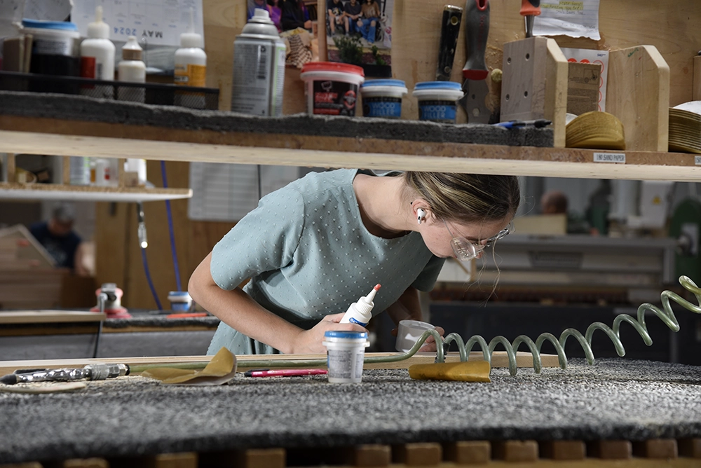 mennonite woman gluing components