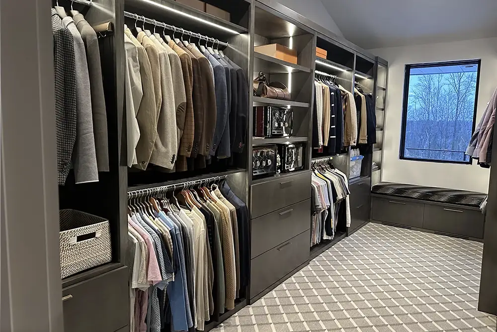 custom closet with hanging suit jackets